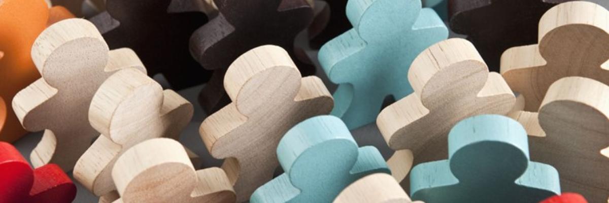 colourful wooden puzzle pieces shaped as people