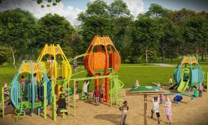 Picture from a different angle showing different play structures such as climbing structures, slides etc.