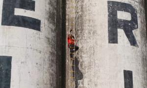 a contestant of the amazing race canada participates in a challenge at the Collingwood Grain Terminals