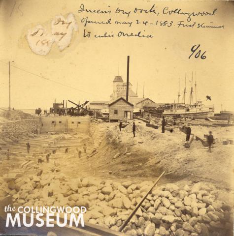 Black and white photograph showing the construction of Collingwood’s first dry dock at the northern extension of St. Paul Street. The dry dock’s opening on May 24, 1883, marked the official start of large-scale shipbuilding in Collingwood. Collingwood Museum Collection X969.238.1; Huron Institute No. 906.
