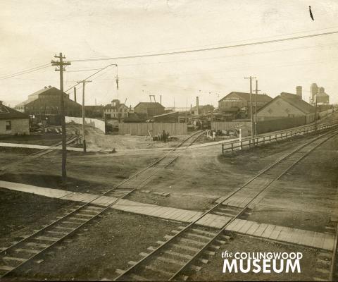 The tracks for the North Grey Railway appear on the left side of the photograph, leaving the historic railway property and heading west towards Meaford. Collingwood Museum Collection X969.239.1.