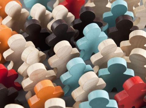 colourful wooden puzzle pieces shaped as people